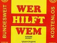 Plakate mit dem Schriftzug "Wer hilft wen" zieren ganz Wien