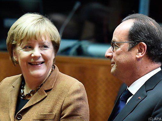 Angela Merkel und Francois Hollande als Vermittler